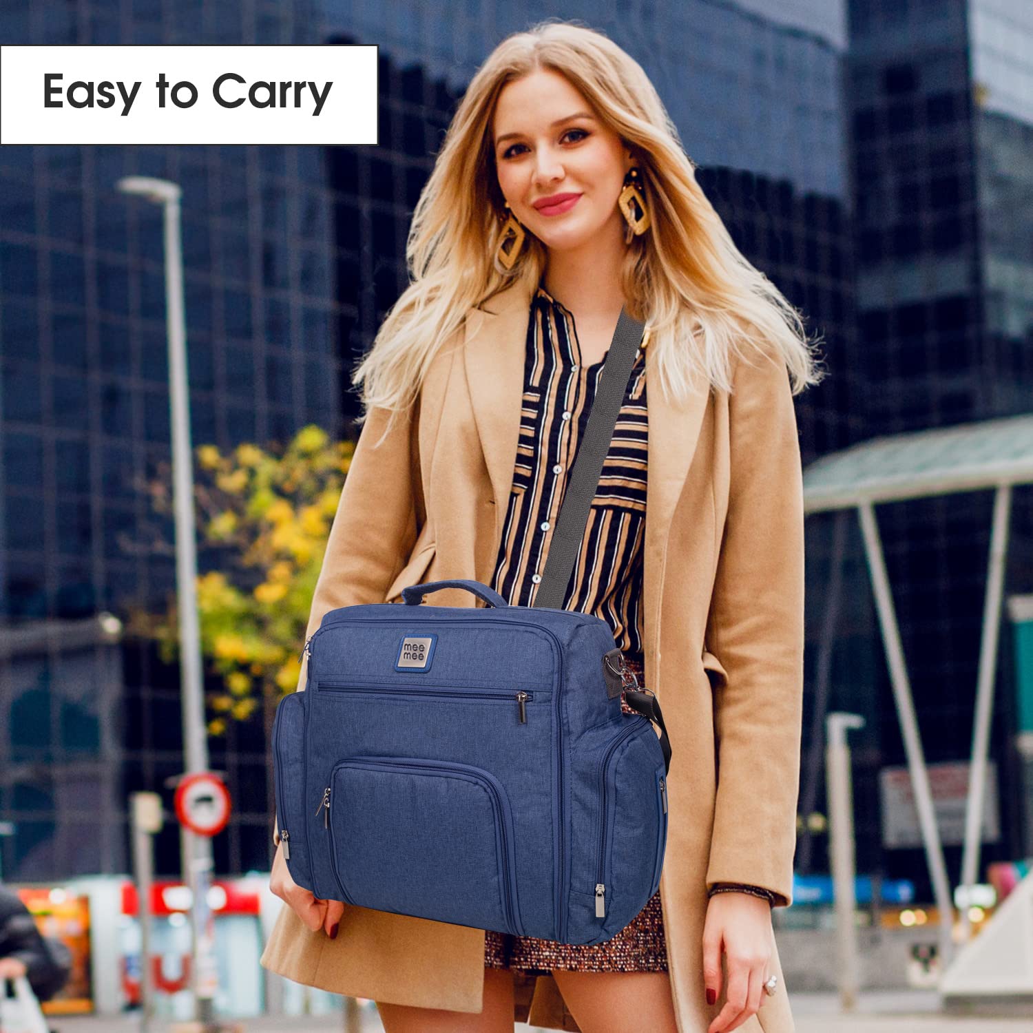 Practical and stylish blue diaper bag for mothers, designed for easy organization of baby essentials on the go. www.usmile.toys